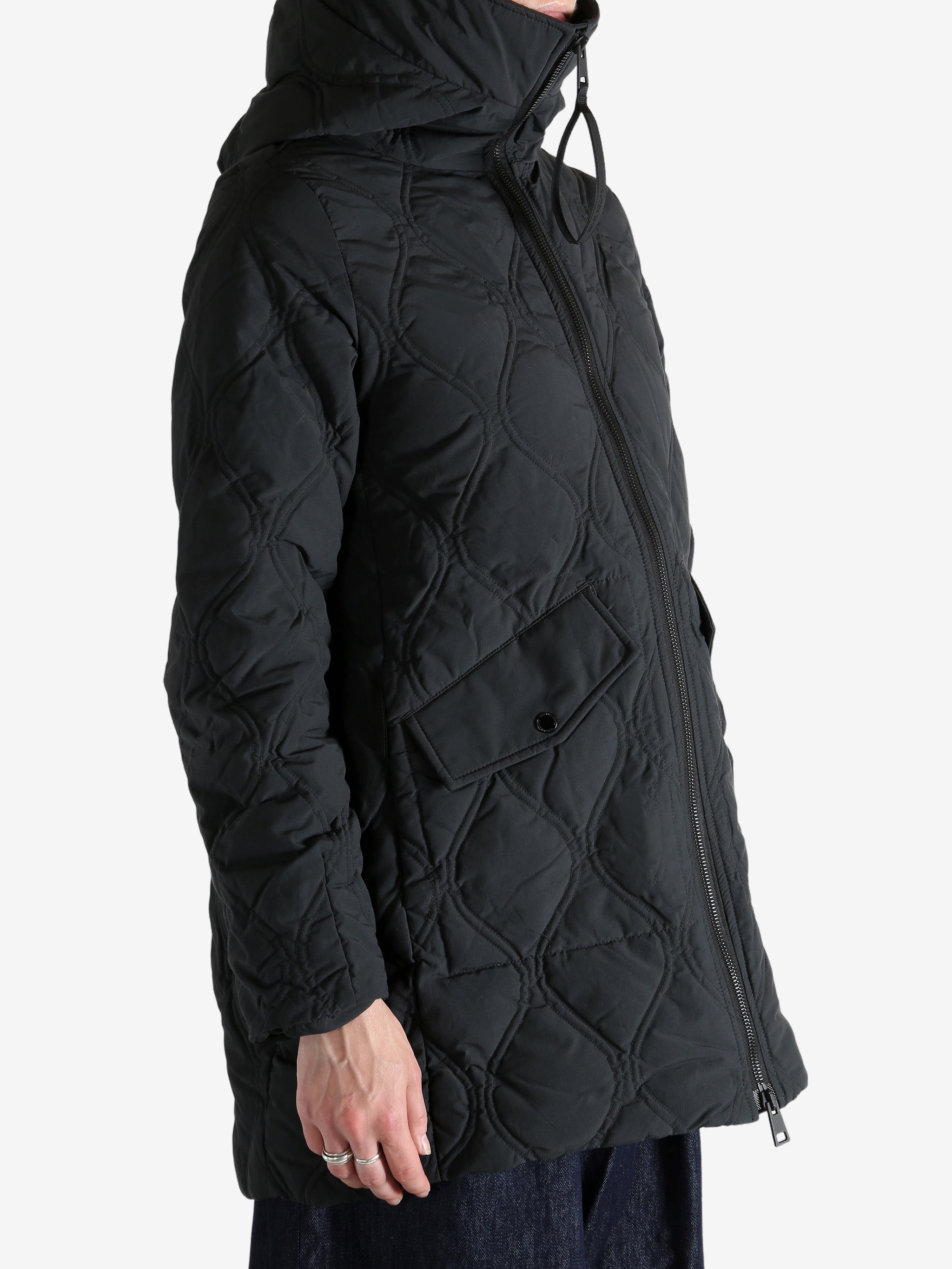 Black jacket worn by a person, showing the jacket's fit