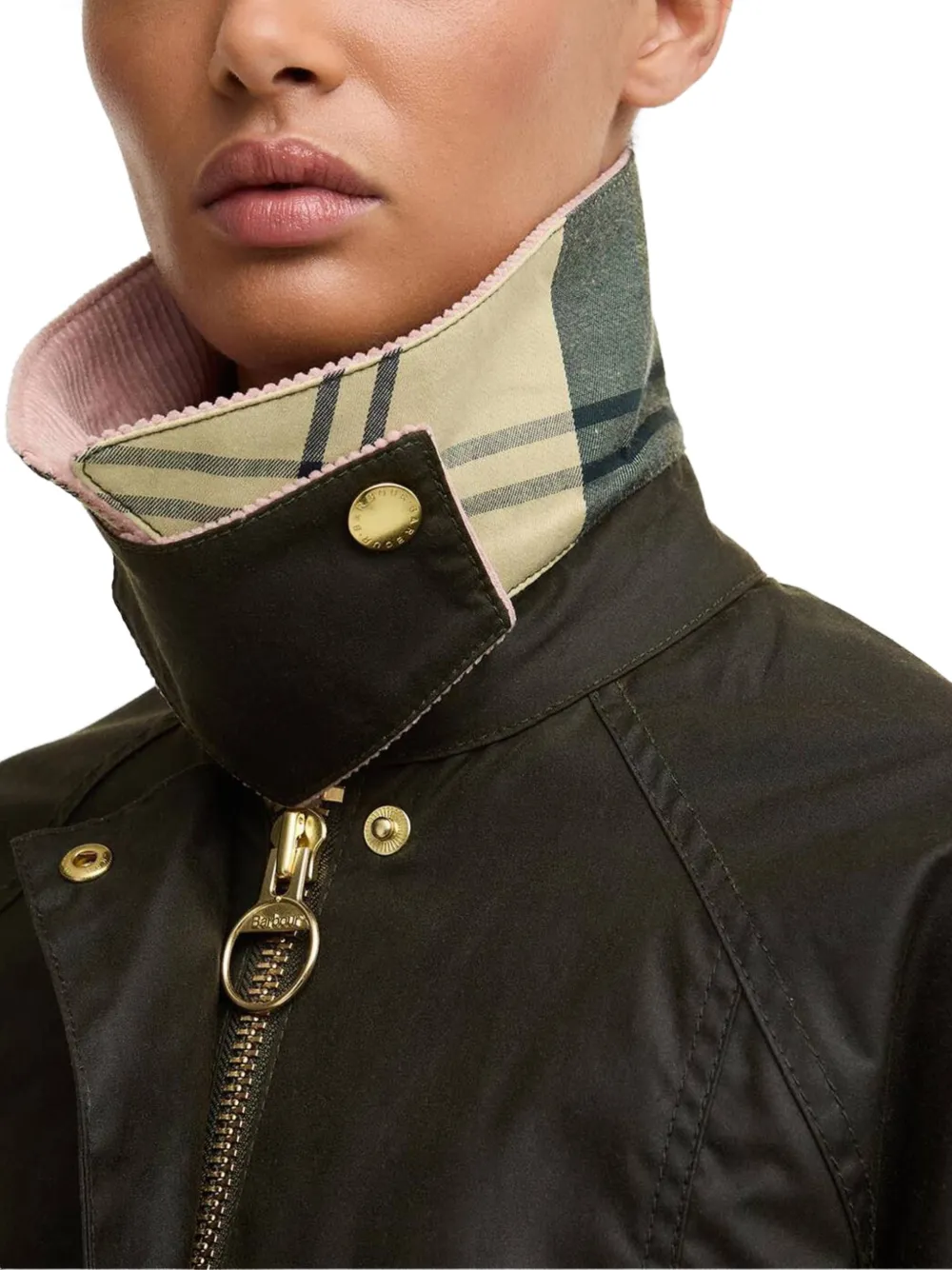 Close up of black jackets-coats, showing texture of the cotton fabric