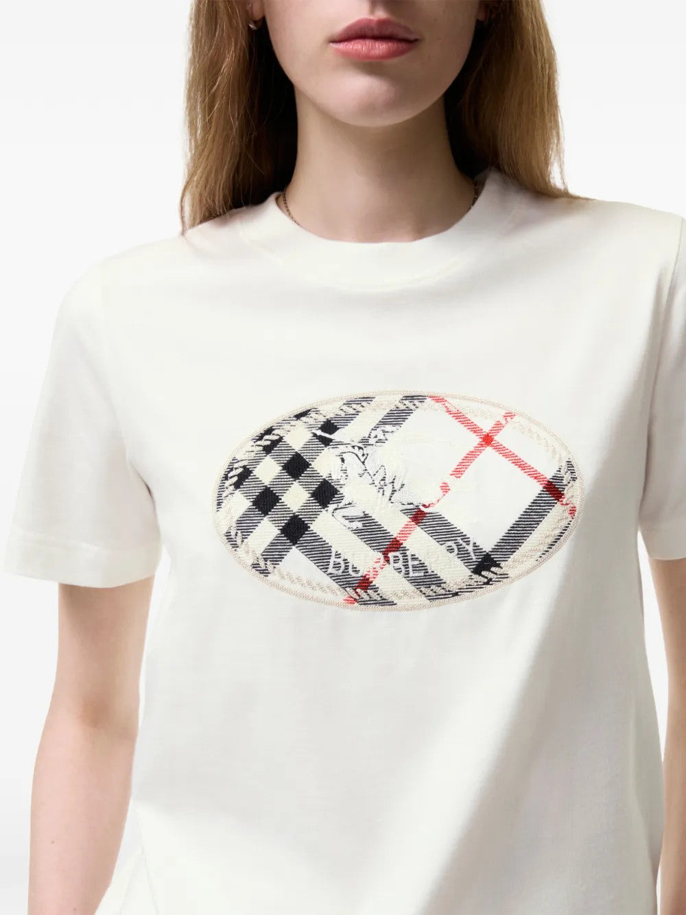 Tan t-shirt worn by a person, showing the t-shirt fit