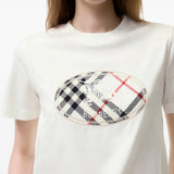 Tan t-shirt worn by a person, showing the t-shirt fit