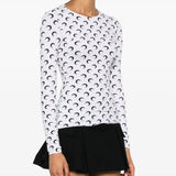 White top worn by a person, showing the top's fit