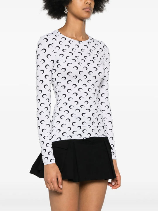 White top worn by a person, showing the top's fit
