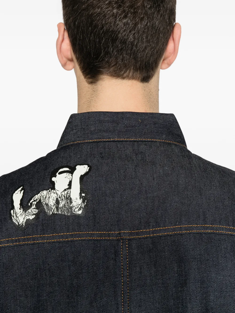 Close up of blue jacket, showing texture of the Cotton fabric