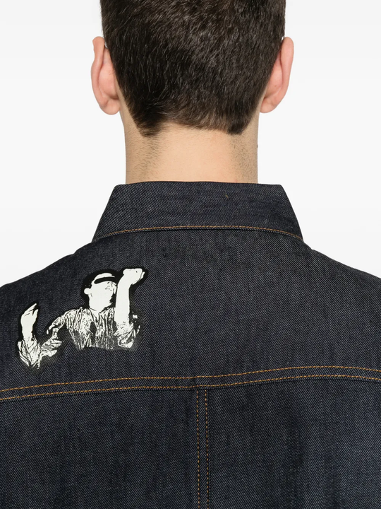 Close up of blue jacket, showing texture of the Cotton fabric