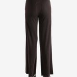 Black pants worn by a person, showing the pants fit