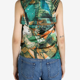 Green top worn by a person, showing the top’s fit