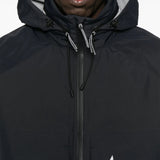 Close up of the black jacket, showing texture of the polyester fabric