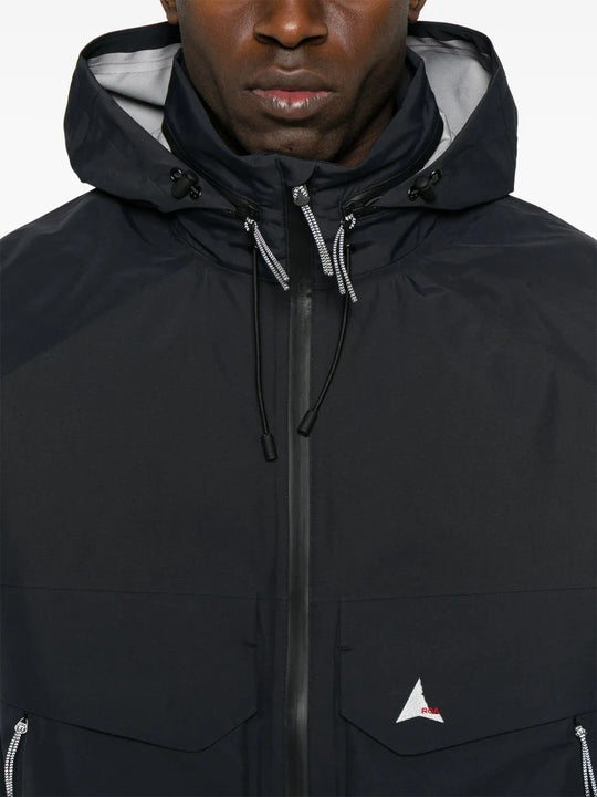 Close up of the black jacket, showing texture of the polyester fabric