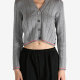 Grey knitwear worn by a person, showing the knitwear's fit