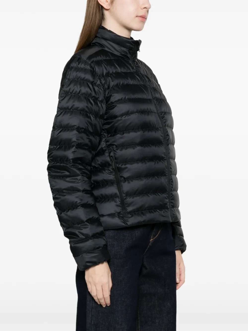 black jacket worn by a person, showing the jacket fit