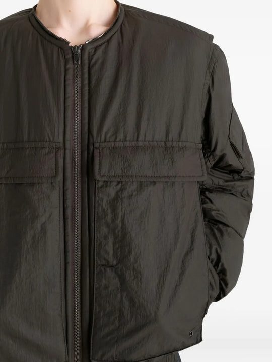 Close up of the brown coat, showing texture of the polyamide fabric