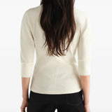 Tan t-shirt worn by a person, showing the t-shirt fit