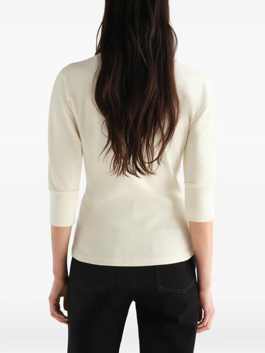 Tan t-shirt worn by a person, showing the t-shirt fit