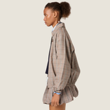 Tan jacket worn by a person, showing the jacket fit