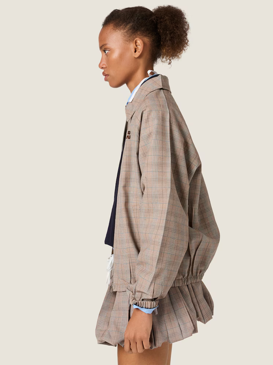 Tan jacket worn by a person, showing the jacket fit