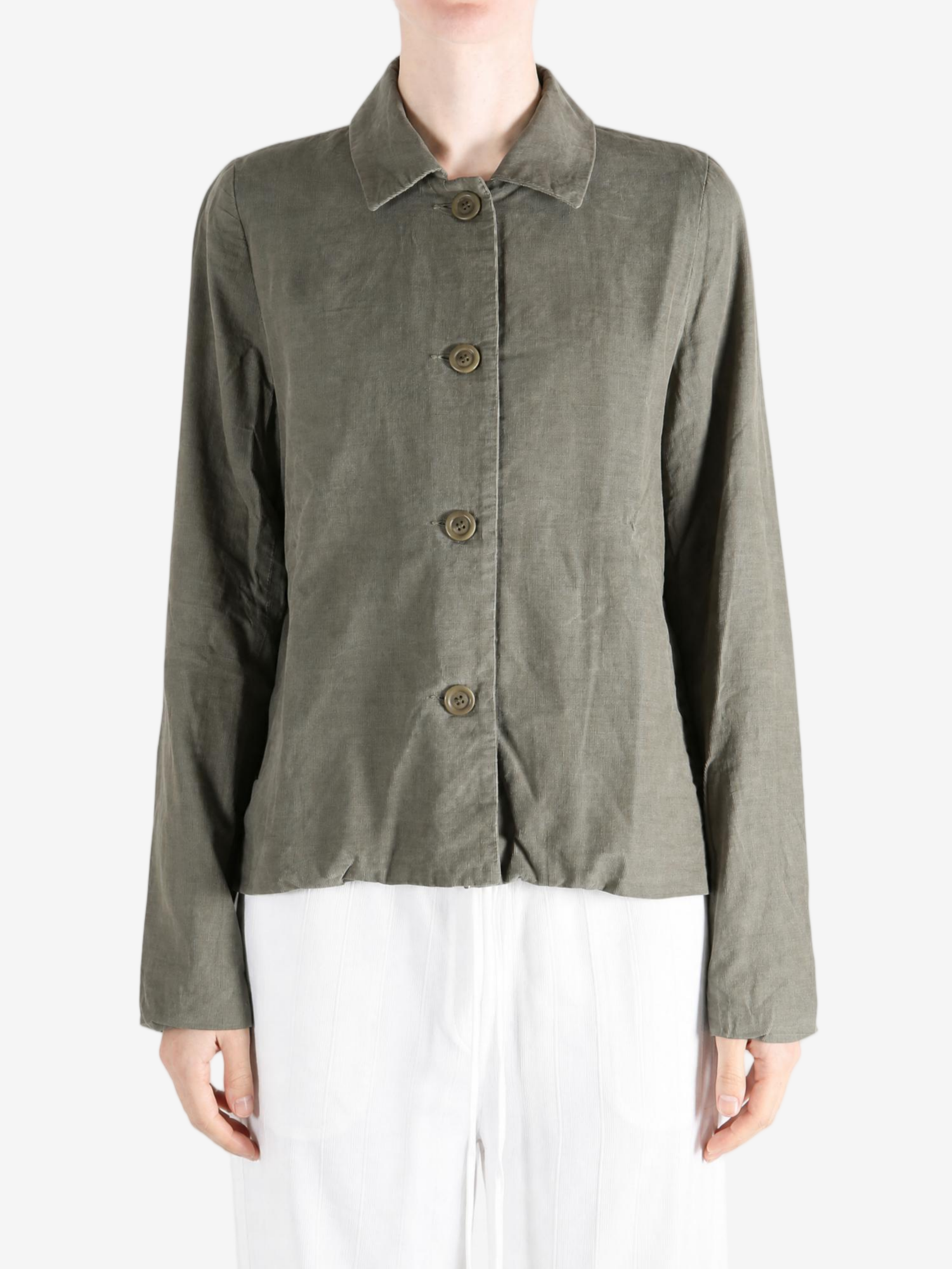 Green jacket worn by a person, showing the jacket fit