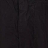 Close up of black pants, showing texture of the cotton fabric