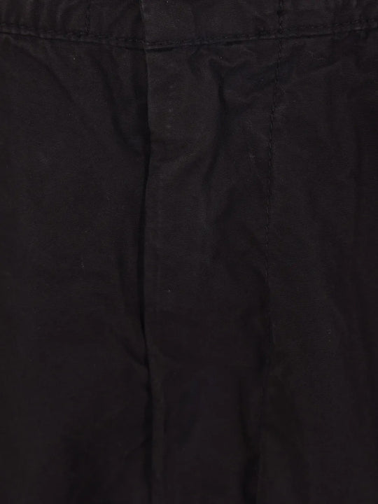 Close up of black pants, showing texture of the cotton fabric