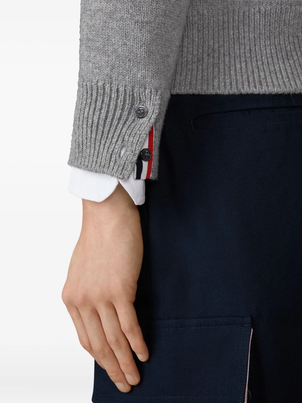 Close up of grey knitwear, showing texture of the Virgin Wool fabric