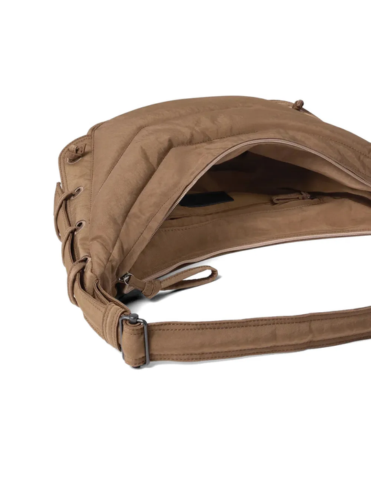 Close up of brown bag, showing texture of the nylon fabric