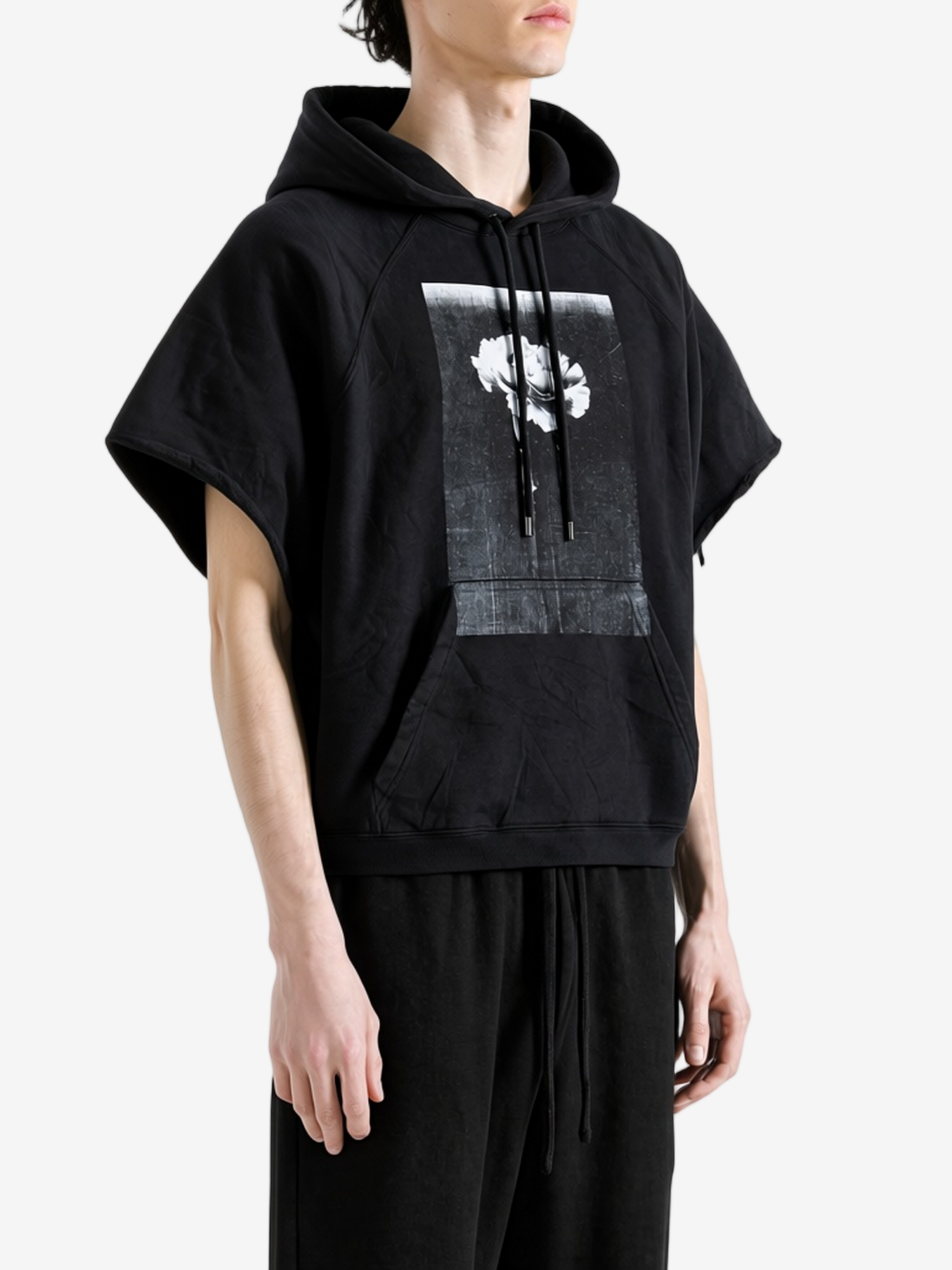 Black hoodie worn by a person, showing the hoodie fit