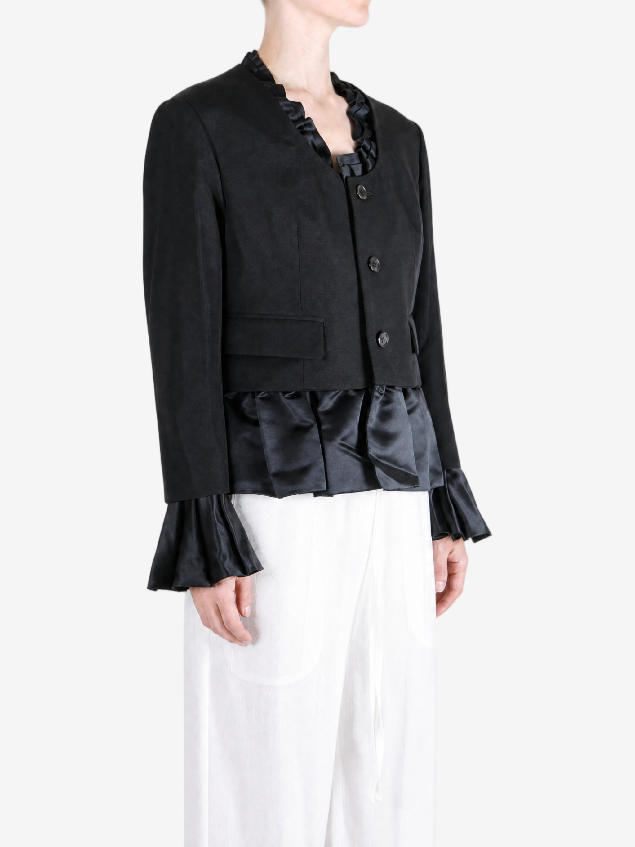 Black jacket worn by a person, showing the jacket fit