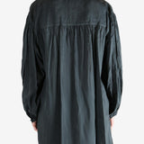 Black shirt,worn by a person, showing the shirt's fit