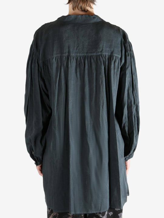 Black shirt,worn by a person, showing the shirt's fit