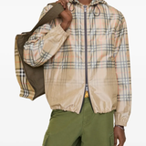 tan hoodie worn by a person, showing the  hoodie fit