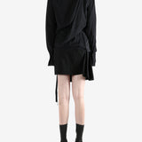 Black top worn by a person, showing the top's fit