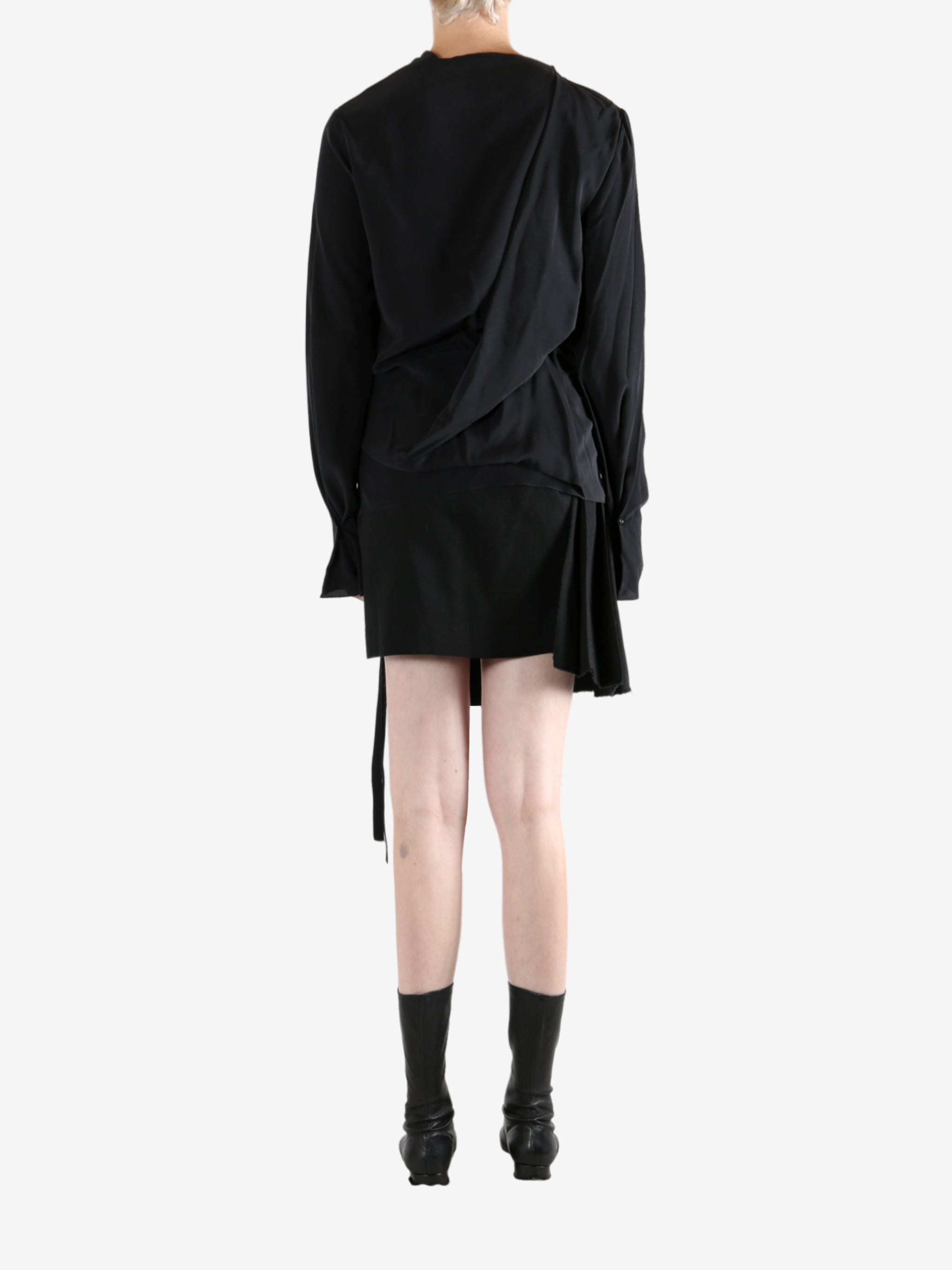 Black top worn by a person, showing the top's fit