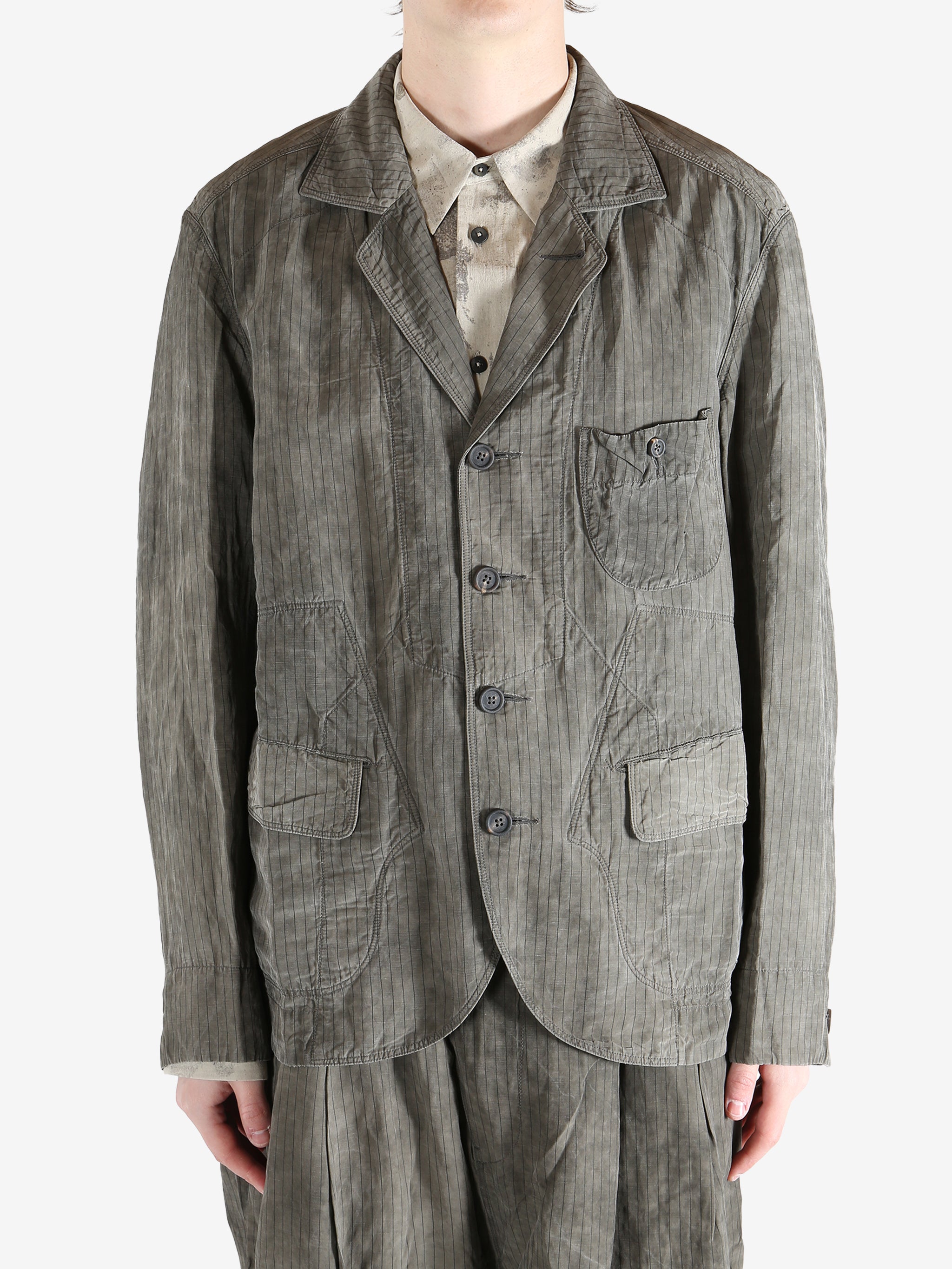 Grey jacket worn by a person, showing the jacket fit