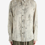 green shirts worn by a person, showing the shirts  fit