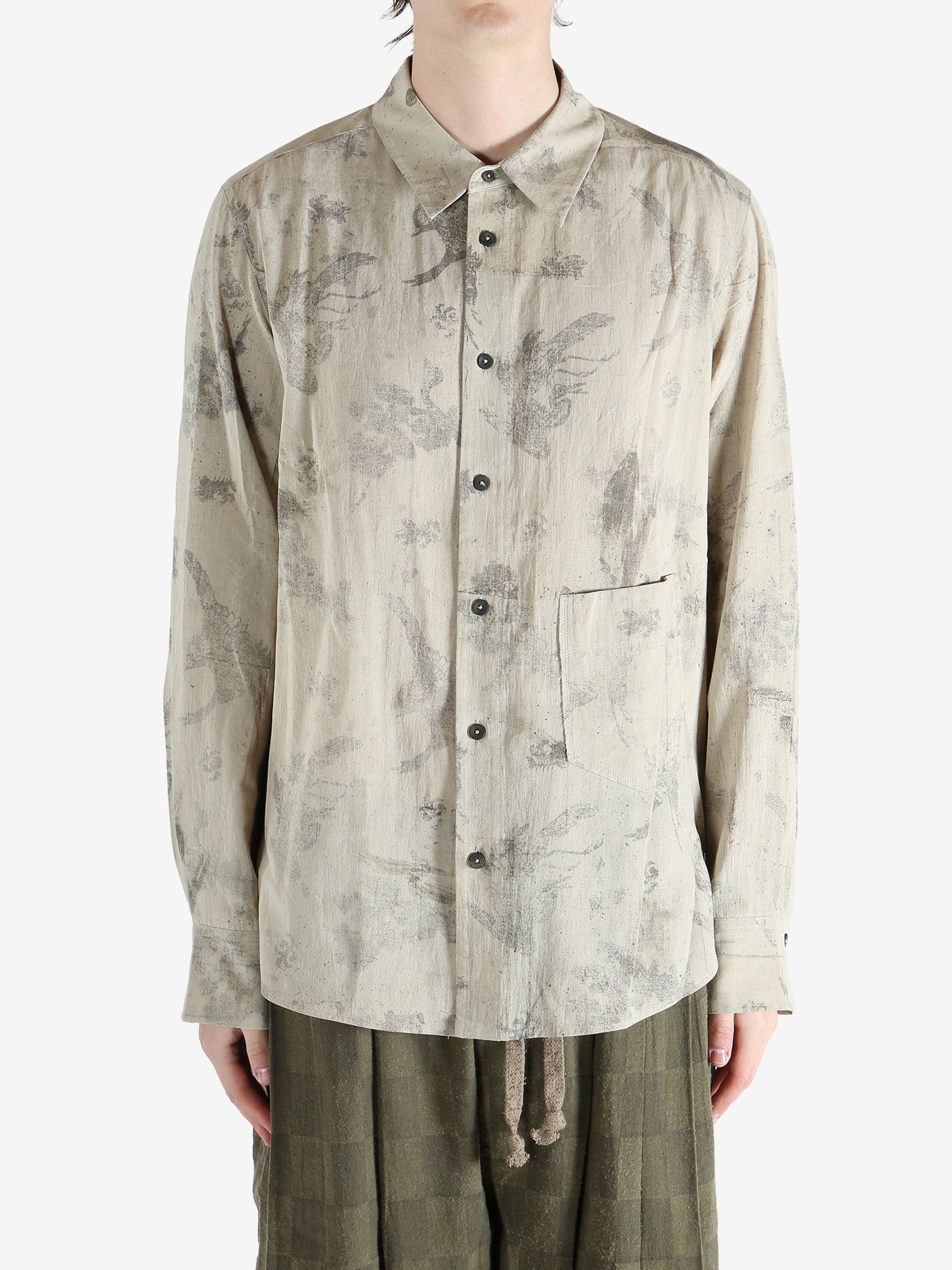 green shirts worn by a person, showing the shirts  fit