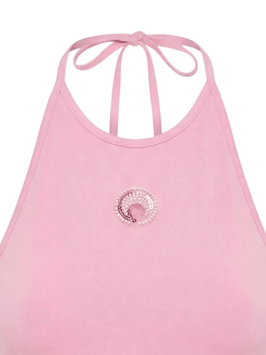 Close up of pink tops, showing texture of the cotton fabric