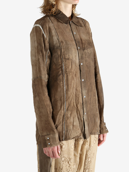 Brown shirt worn by a person, showing the shirt's fit