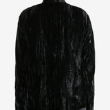 Black jacket worn by a person, showing the jacket's fit