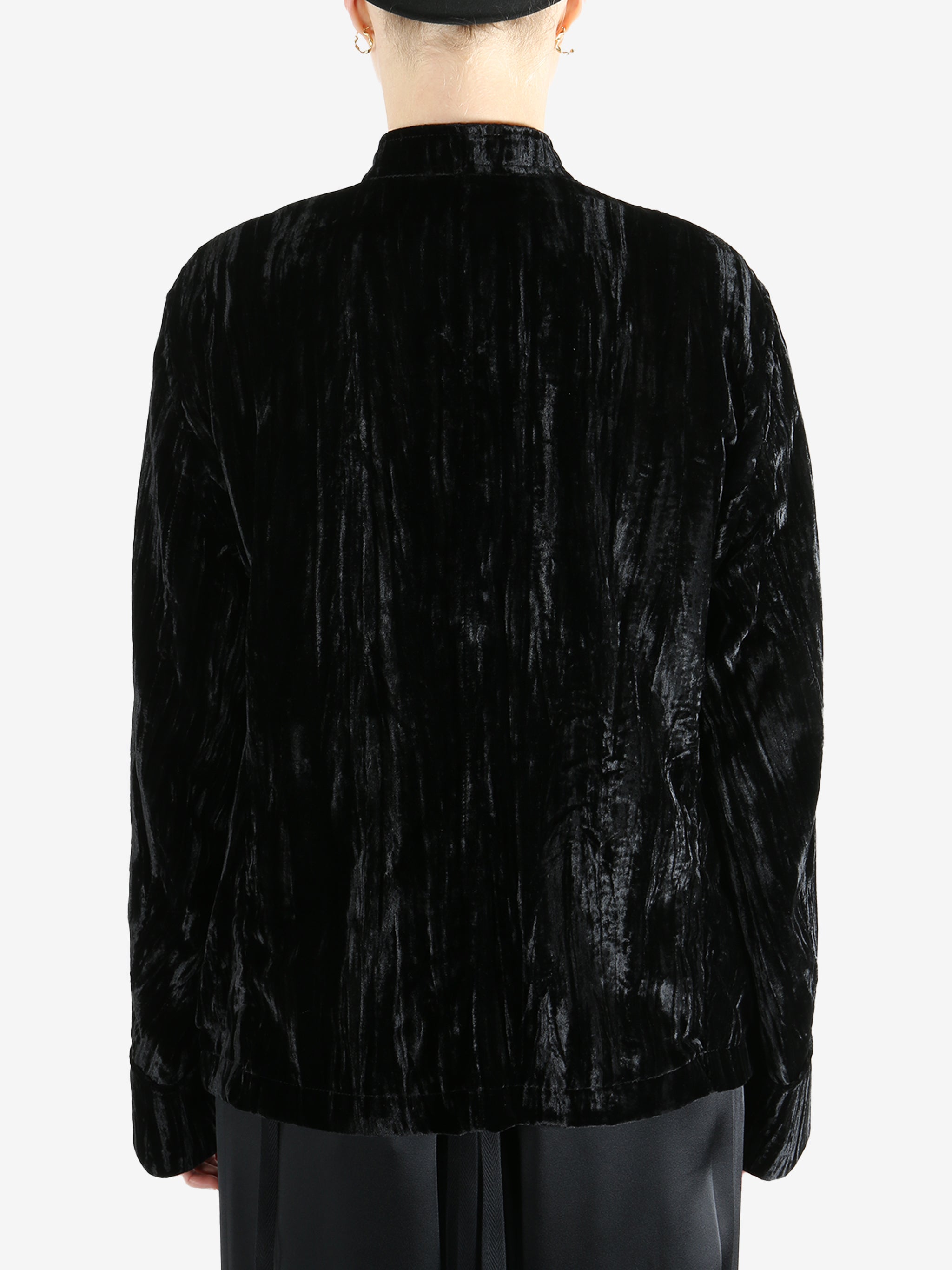 Black jacket worn by a person, showing the jacket's fit