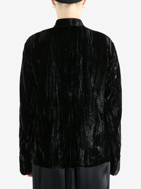 Black jacket worn by a person, showing the jacket's fit