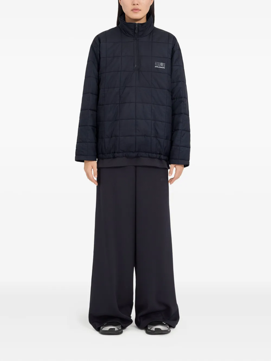 Blue jackets worn by a person, showing the jackets fit