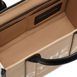 Close up of brown bag, showing texture of the leather fabric