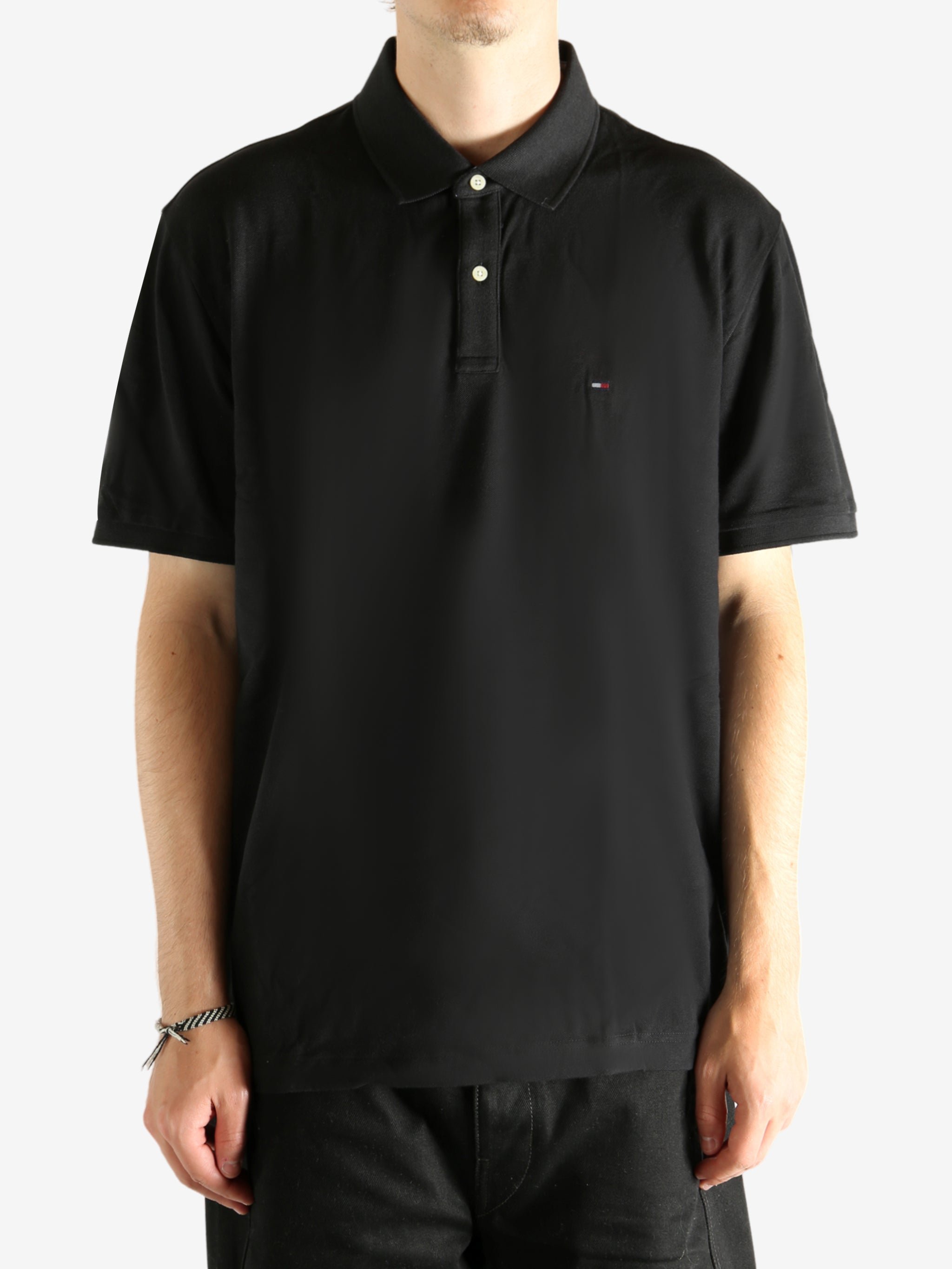 Black T-shirt  worn by a person, showing the T-shirt's fit