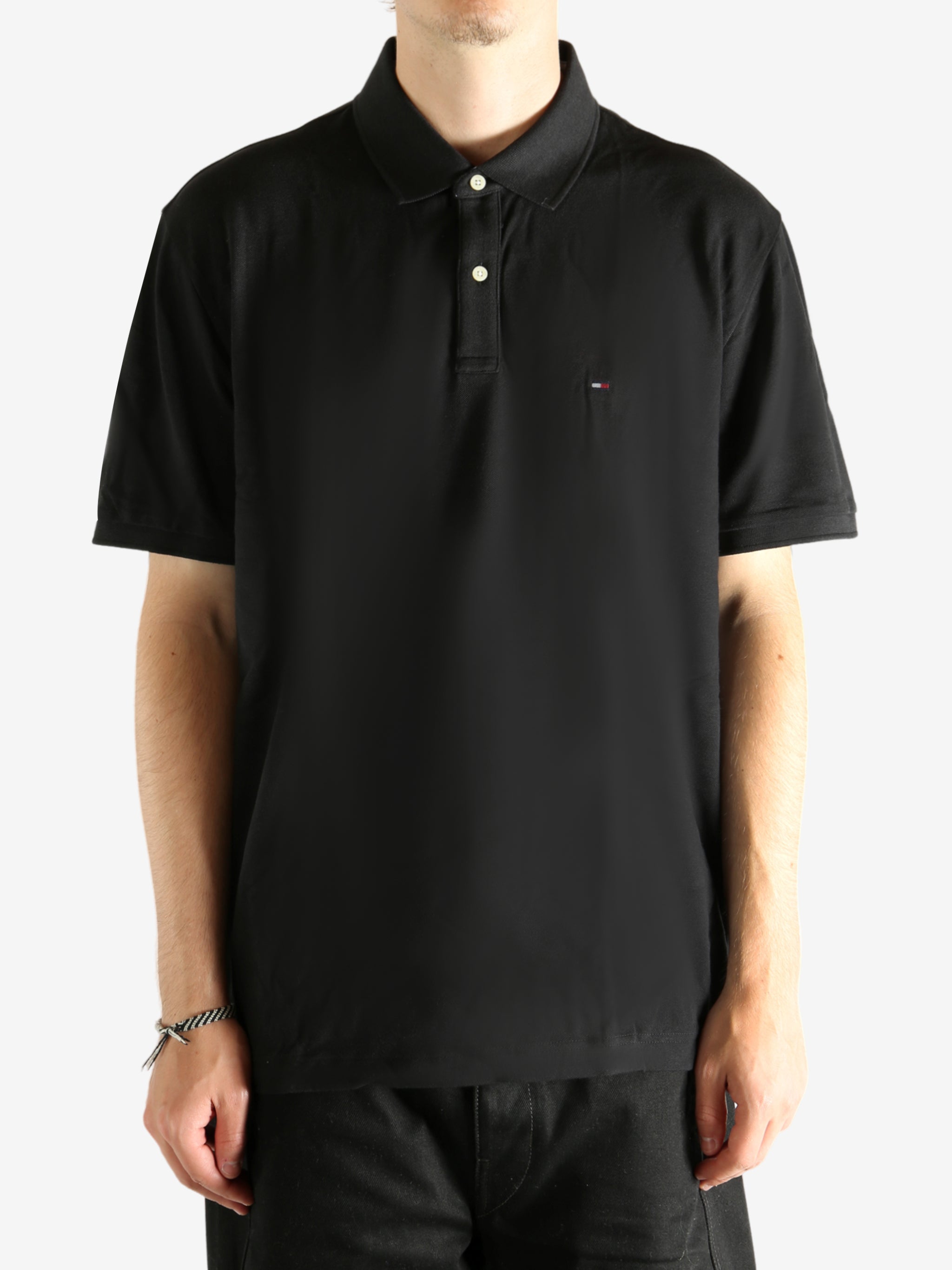 Black T-shirt  worn by a person, showing the T-shirt's fit