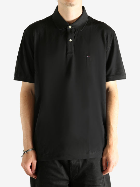 Black T-shirt  worn by a person, showing the T-shirt's fit