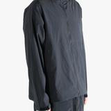 Gray jacket worn by a person, showing the jacket fit