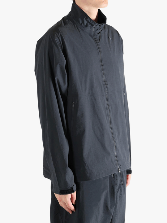 Gray jacket worn by a person, showing the jacket fit