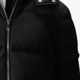 Close up of black jacket,showing texture of the polyester fabric.