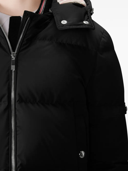 Close up of black jacket,showing texture of the polyester fabric.