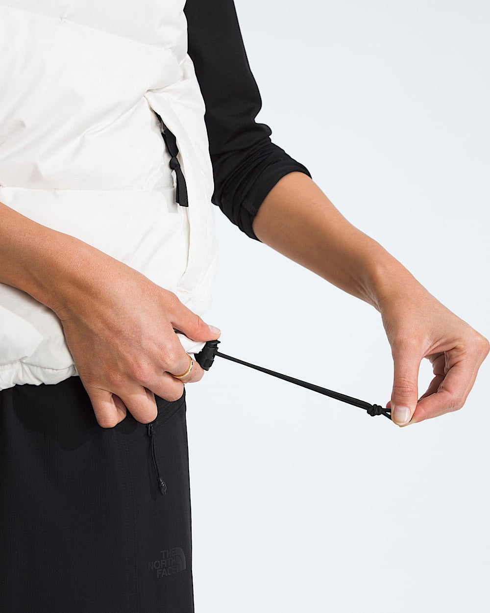 White top worn by a person, showing the top fit