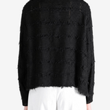 Black shirt worn by a person, showing the shirt fit